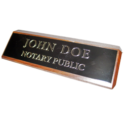 This elegant, genuine Mississippi notary walnut desk, sign is made of solid wood and engraved on a metal plate with gold lettering with your notary name and the wording 'Notary Public'. It makes a fine addition to any desk or office. This sign can be customized with up to two lines.